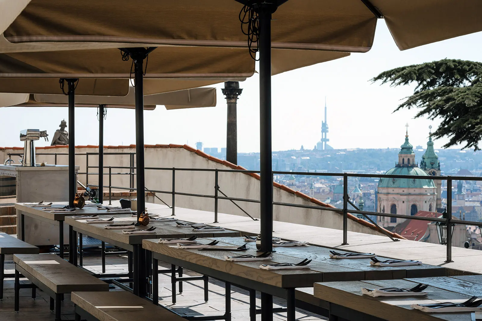 View from Kuchyň restaurant terrace overlooking the Prague city skyline.
